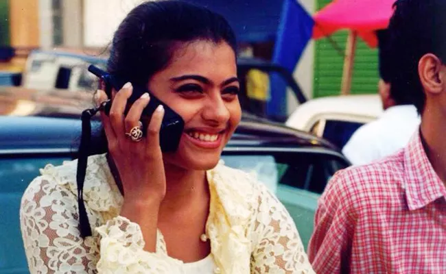 Kajol shares a throwback pic of the days when phones were big and shoes were comfy - Sakshi