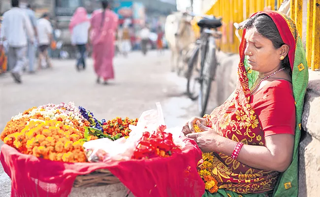 Life of flowers selling peoples - Sakshi