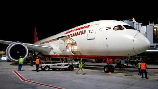 Air India flight attendant falls off plane at Mumbai airport - Sakshi