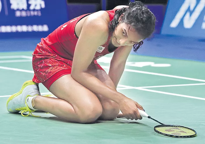 Sindhu knocked out in first round - Sakshi