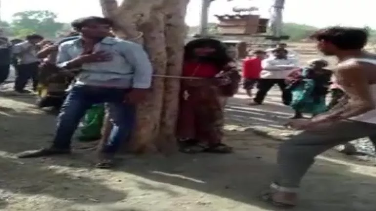 Madhya Pradesh Man Elopes With Married Woman Is Tied To Tree - Sakshi