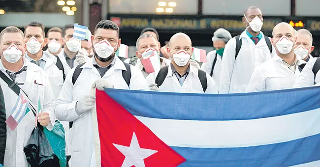 Cuban doctors and nurses arrive in Milan to help fight - Sakshi