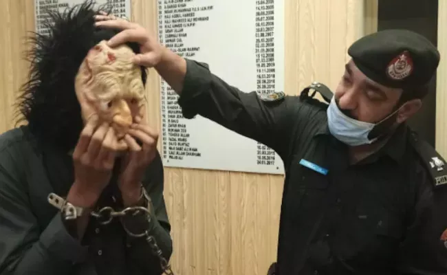 Peshawar Man Arrested Over Wearing Mask To Scare People At Pakistan - Sakshi