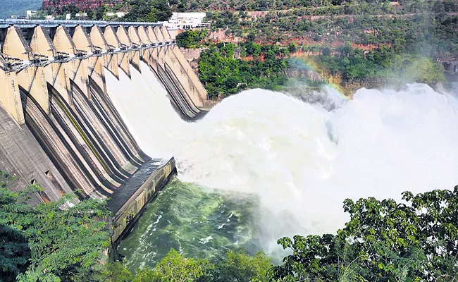 4 gates lifted and water released In Srisailam Dam - Sakshi