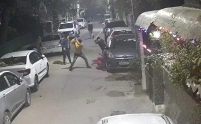 Delhi On CCTV Woman Daughter Beaten With Sticks Iron Rods - Sakshi