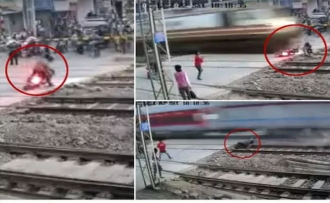 Biker Narrowly EscapesBeing Hit By Speeding train, Video Goes Viral - Sakshi