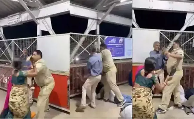 Women Beats Police With Slipper At Railway Station in Uttar Pradesh - Sakshi