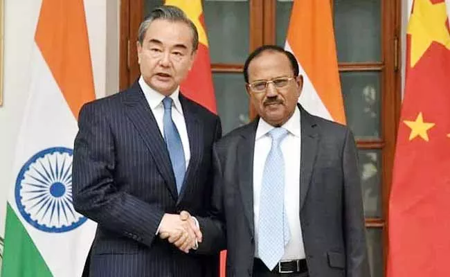 NSA Ajit Doval Meets Chinese Foreign Minister Wang Yi - Sakshi