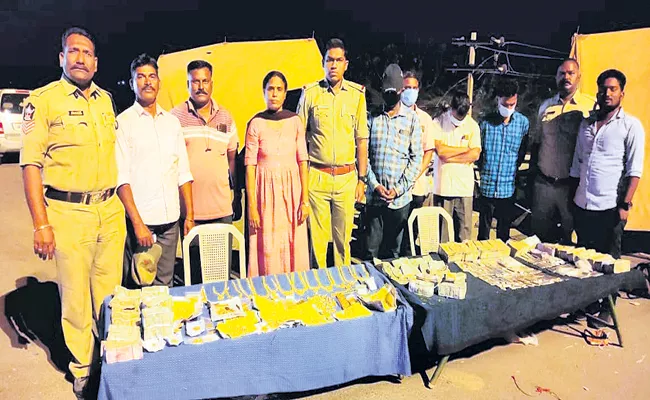 Gold and silver biscuits Caught in Private Travel Bus - Sakshi