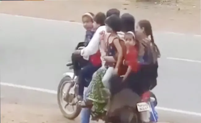 A Family Of Seven Getting On A Single Bike Video Viral - Sakshi