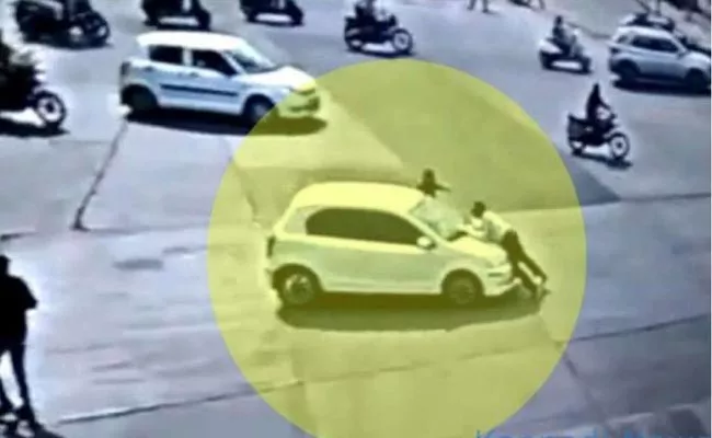 Traffic Cop Dragged On Top Of Car Bonnet For 4 KM In Indore - Sakshi