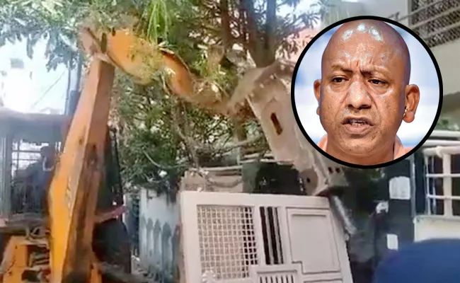 Bulldozers Property Of Atiq Ahmed Close Aide Up - Sakshi