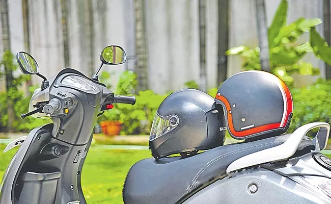 Two quality helmets at the time of purchase of two wheeler - Sakshi