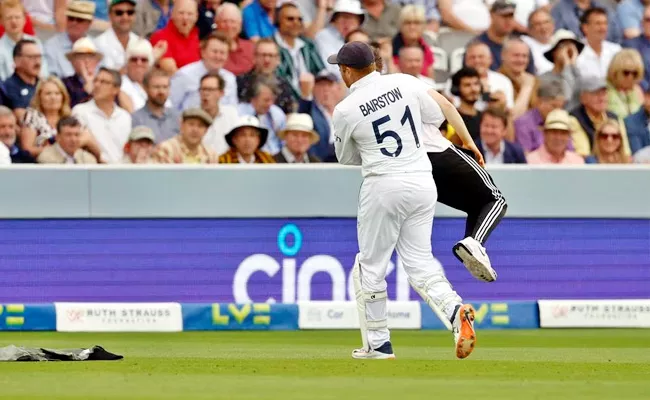 Two Protestors Invade Pitch Jonny Bairstow-Removes Them-Playing Surface - Sakshi