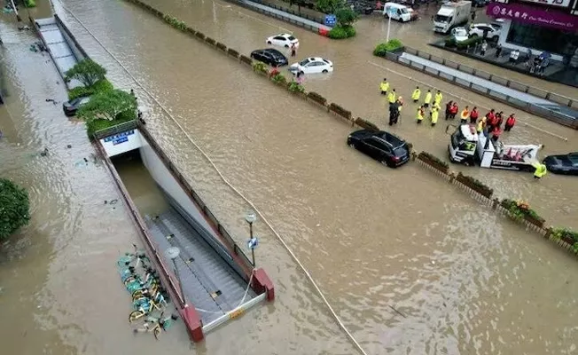 Beijing floods: Deadly rains batter China capital as new storm looms - Sakshi