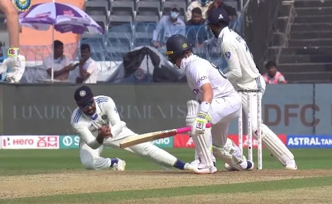 Rohit Sharma takes a sharp catch at slips to dismiss Ollie Pope - Sakshi