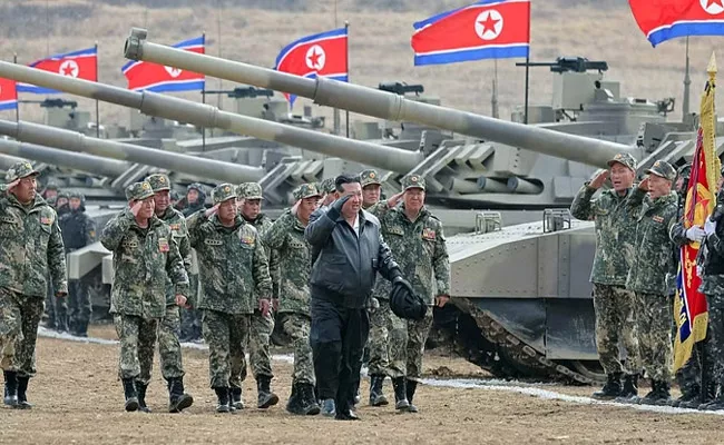 Kim Jong un in Leather Jacket Drives North Koreas New Tank - Sakshi