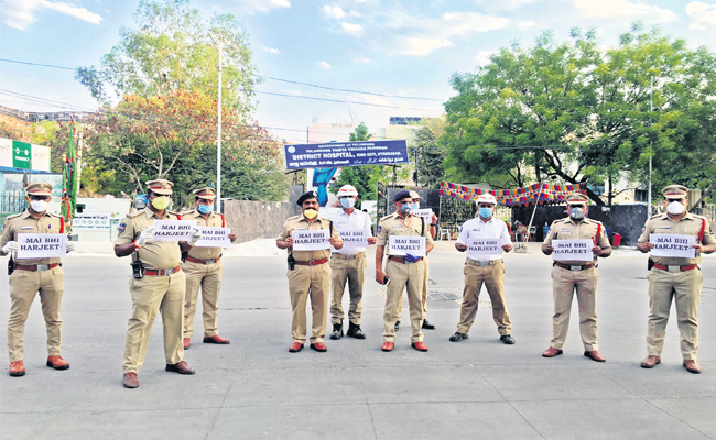 Police officers standing together after a ceremony honouring an officer