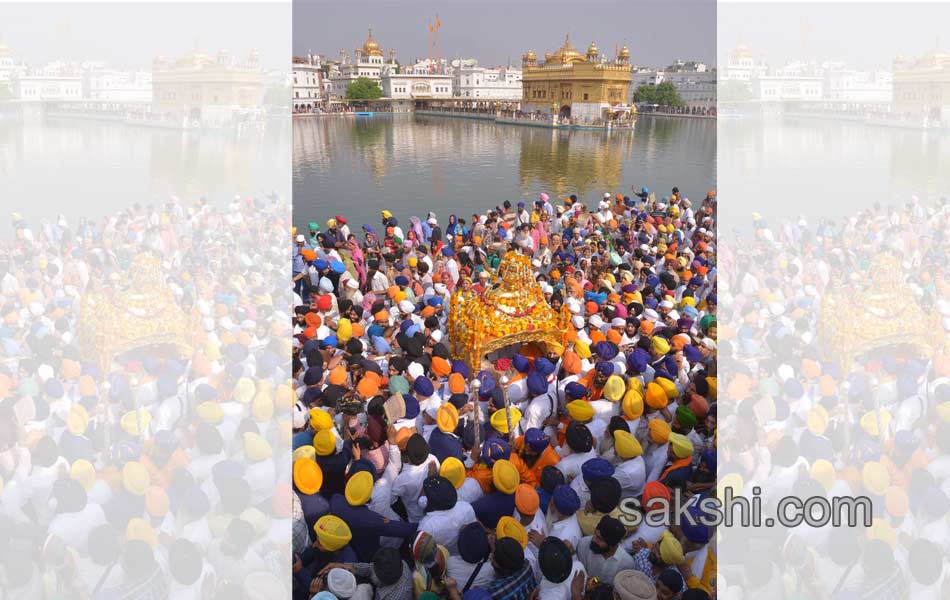 Sikh priest sits behind the Guru Granth Sahib13