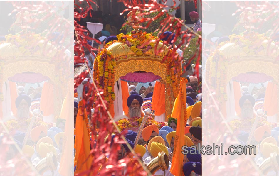 Sikh priest sits behind the Guru Granth Sahib9
