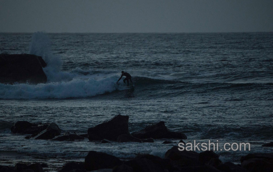 A surfer looks at the Northern lights8