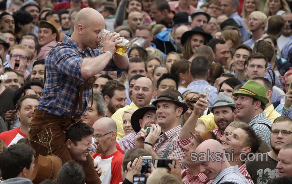 Visitors enjoys the Oktoberfest beer festival in Munich Germany16