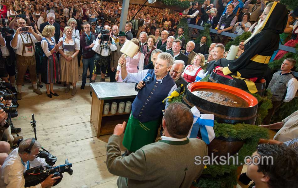 Visitors enjoys the Oktoberfest beer festival in Munich Germany15