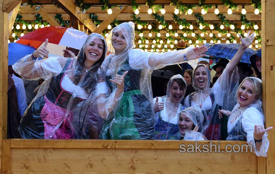 Visitors enjoys the Oktoberfest beer festival in Munich Germany14