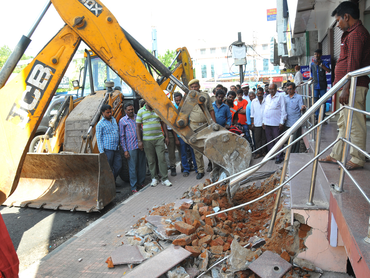 Demolition of Footpath Photo Gallery - Sakshi2