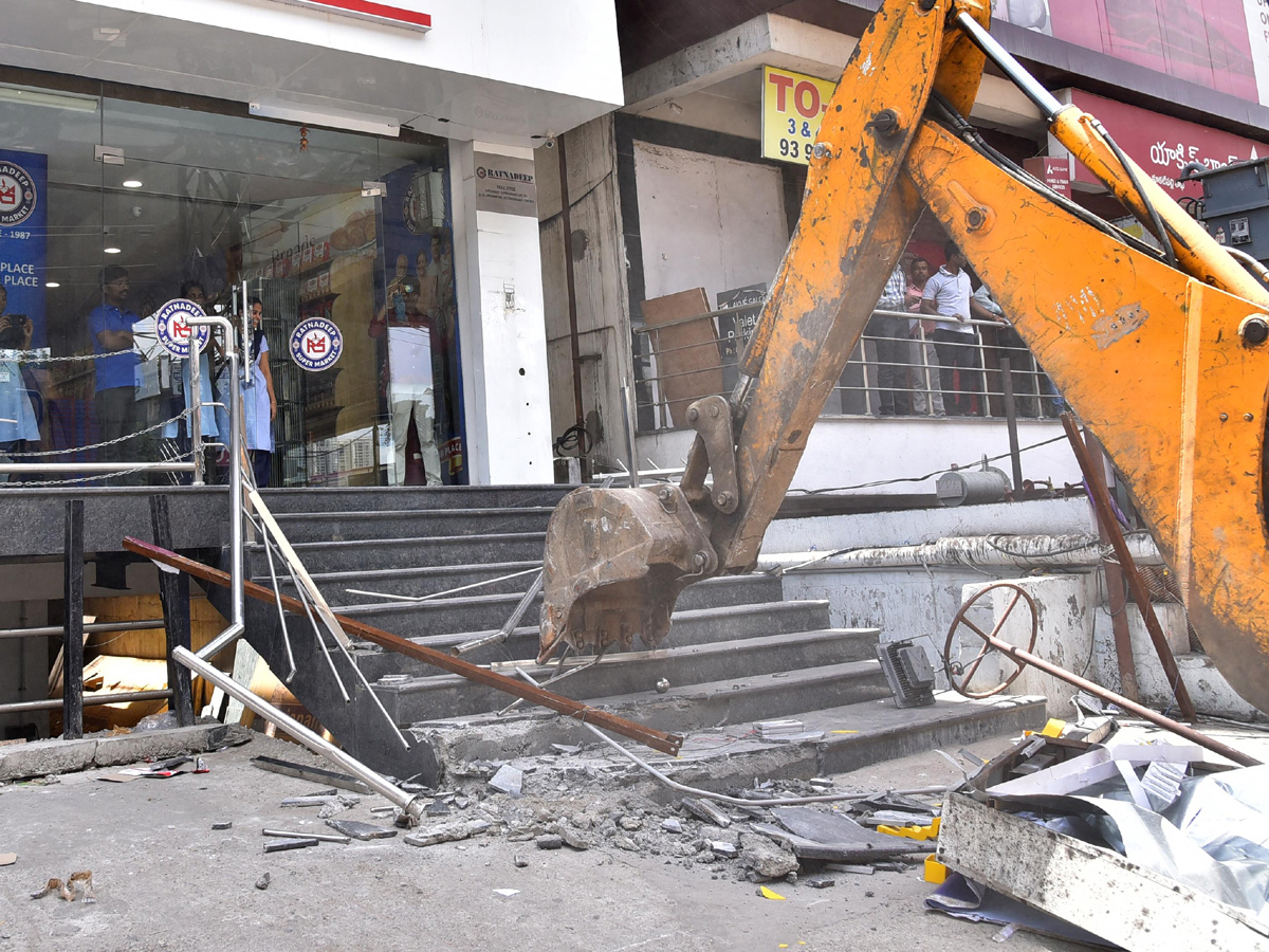 Demolition of Footpath Photo Gallery - Sakshi12