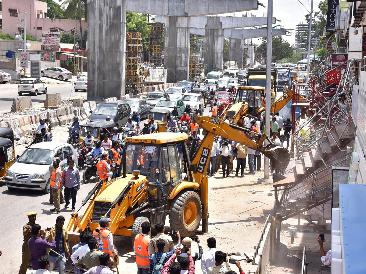 Demolition of Footpath Photo Gallery - Sakshi13
