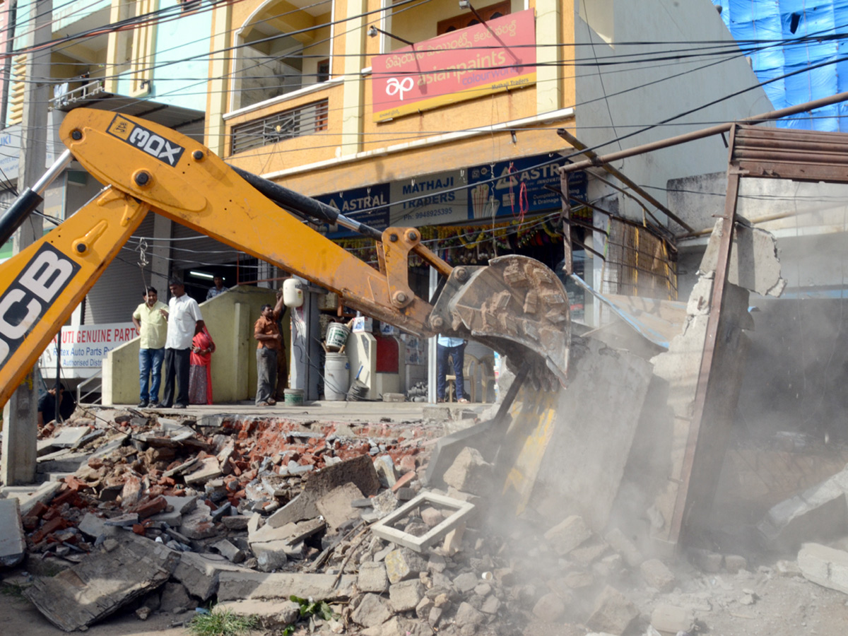 Demolition of Footpath Photo Gallery - Sakshi20