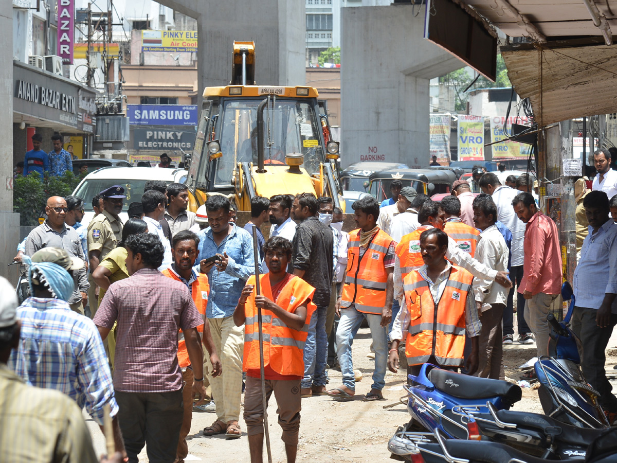 Demolition of Footpath Photo Gallery - Sakshi26