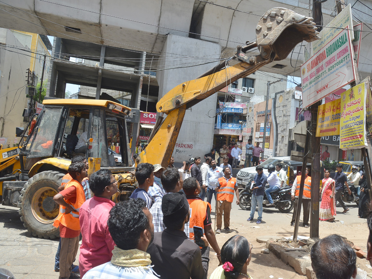 Demolition of Footpath Photo Gallery - Sakshi27
