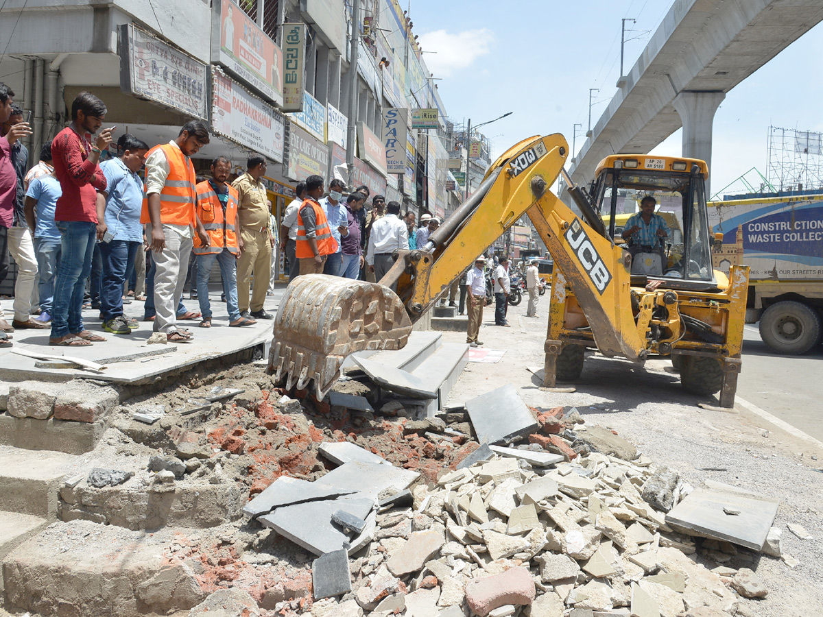 Demolition of Footpath Photo Gallery - Sakshi28