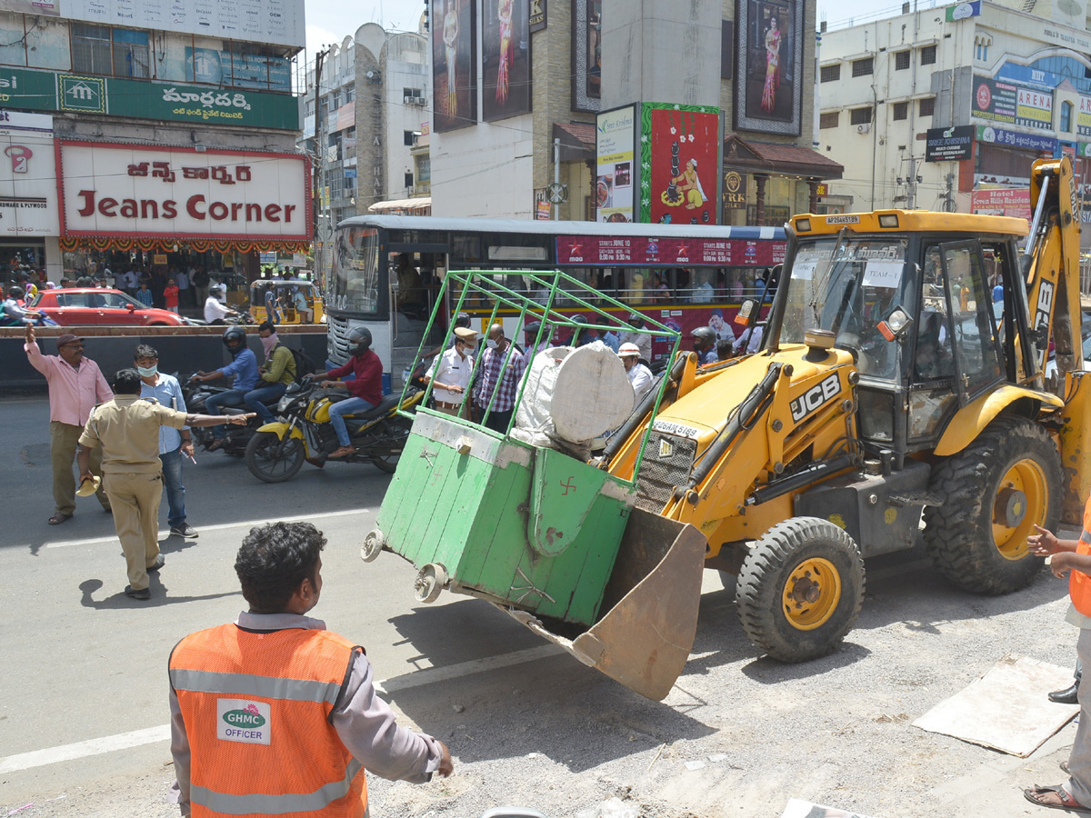 Demolition of Footpath Photo Gallery - Sakshi30