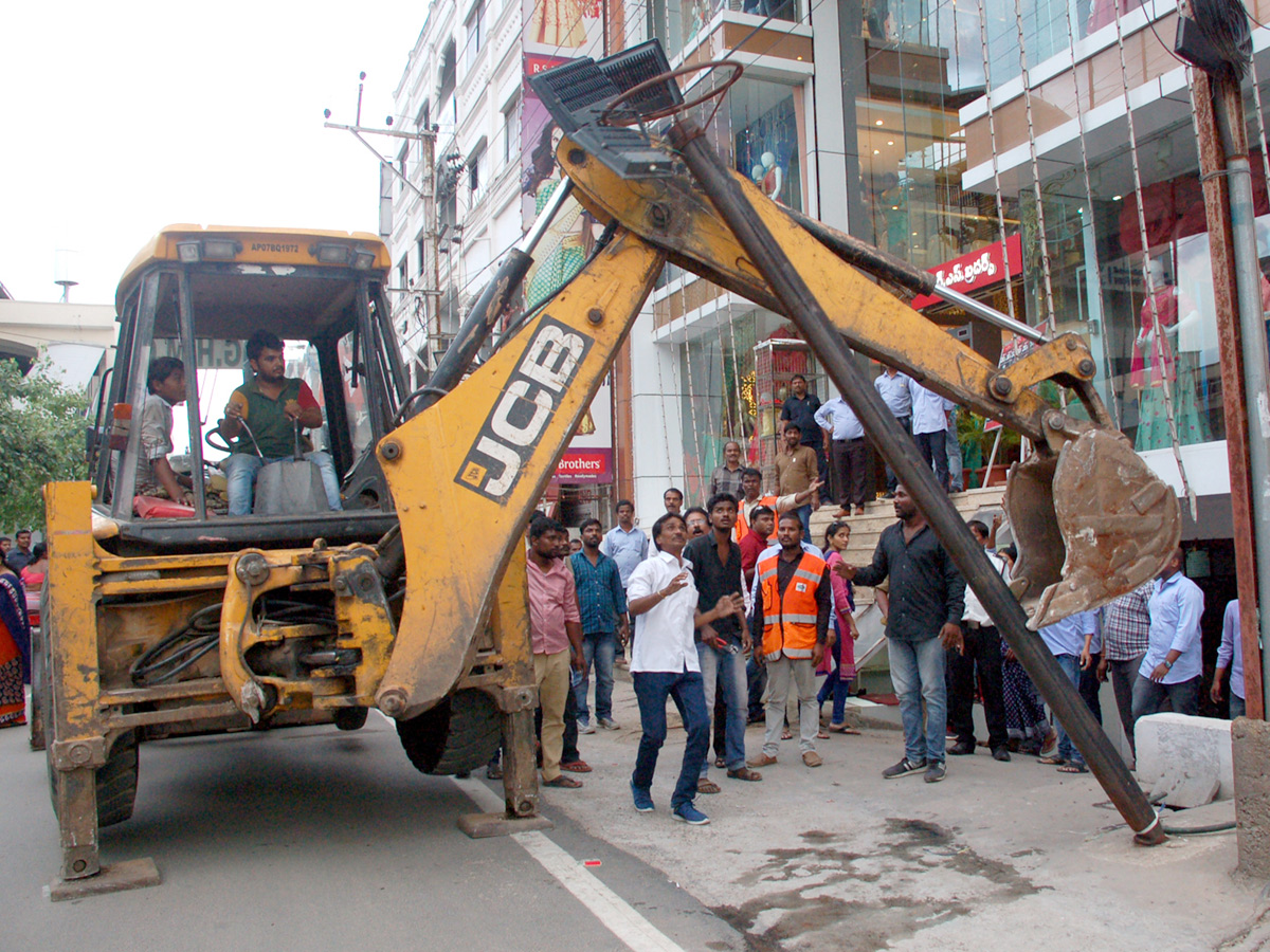 Demolition of Footpath Photo Gallery - Sakshi32
