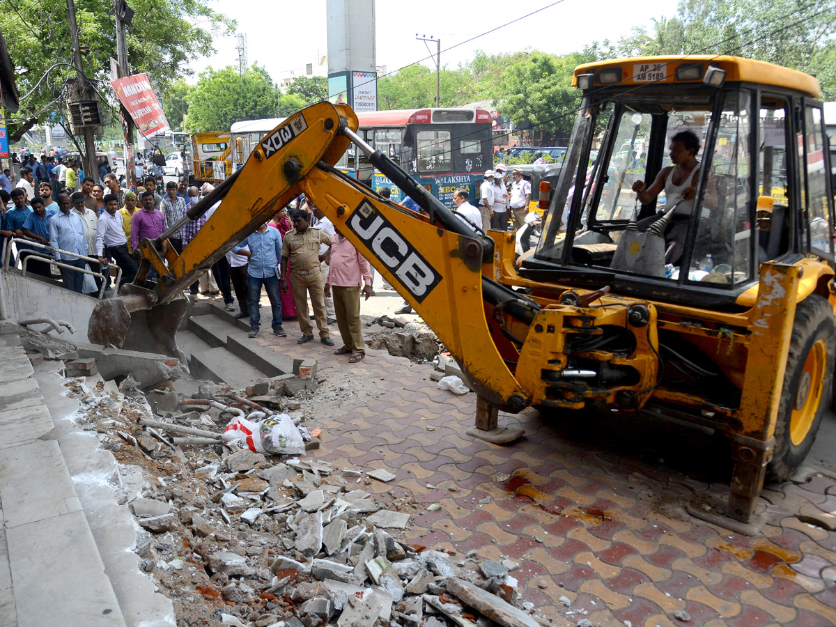 Demolition of Footpath Photo Gallery - Sakshi37