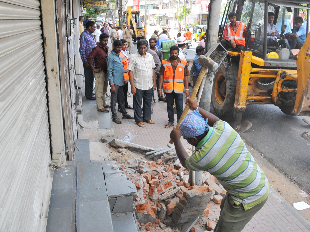 Demolition of Footpath Photo Gallery - Sakshi5