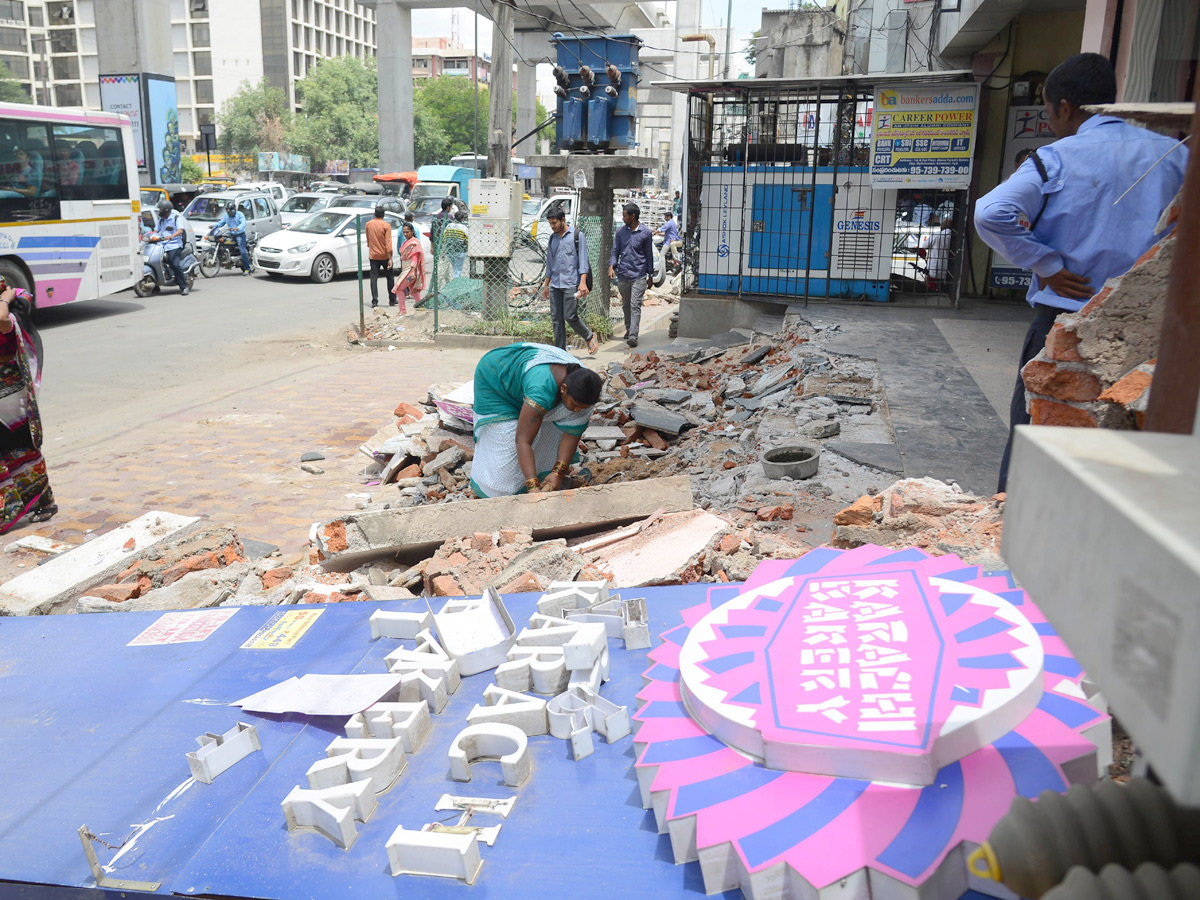Demolition of Footpath Photo Gallery - Sakshi41