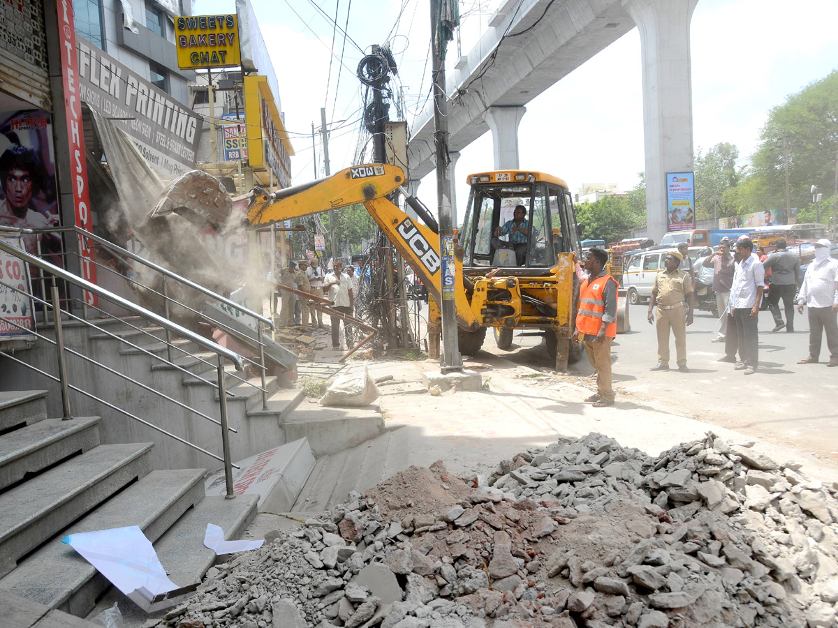 Demolition of Footpath Photo Gallery - Sakshi42
