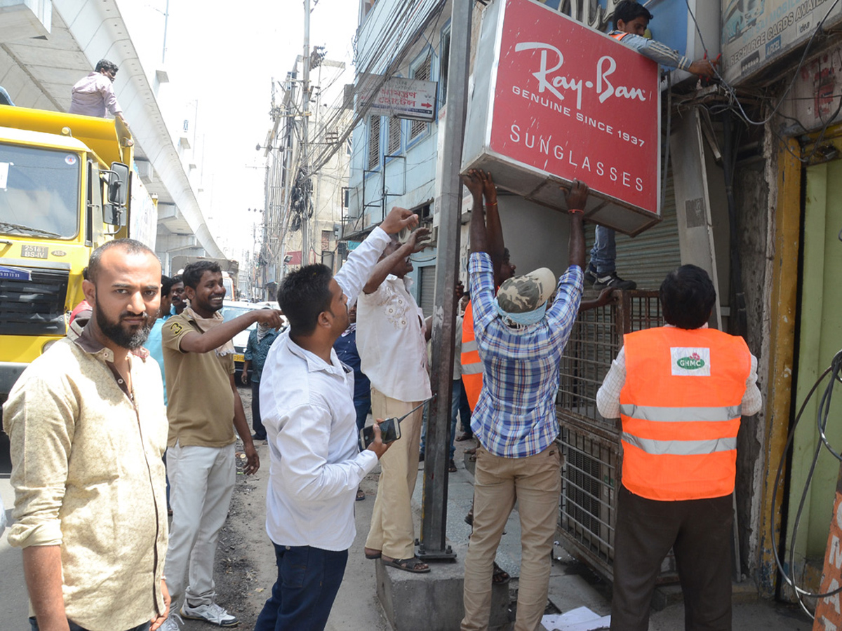 Demolition of Footpath Photo Gallery - Sakshi7