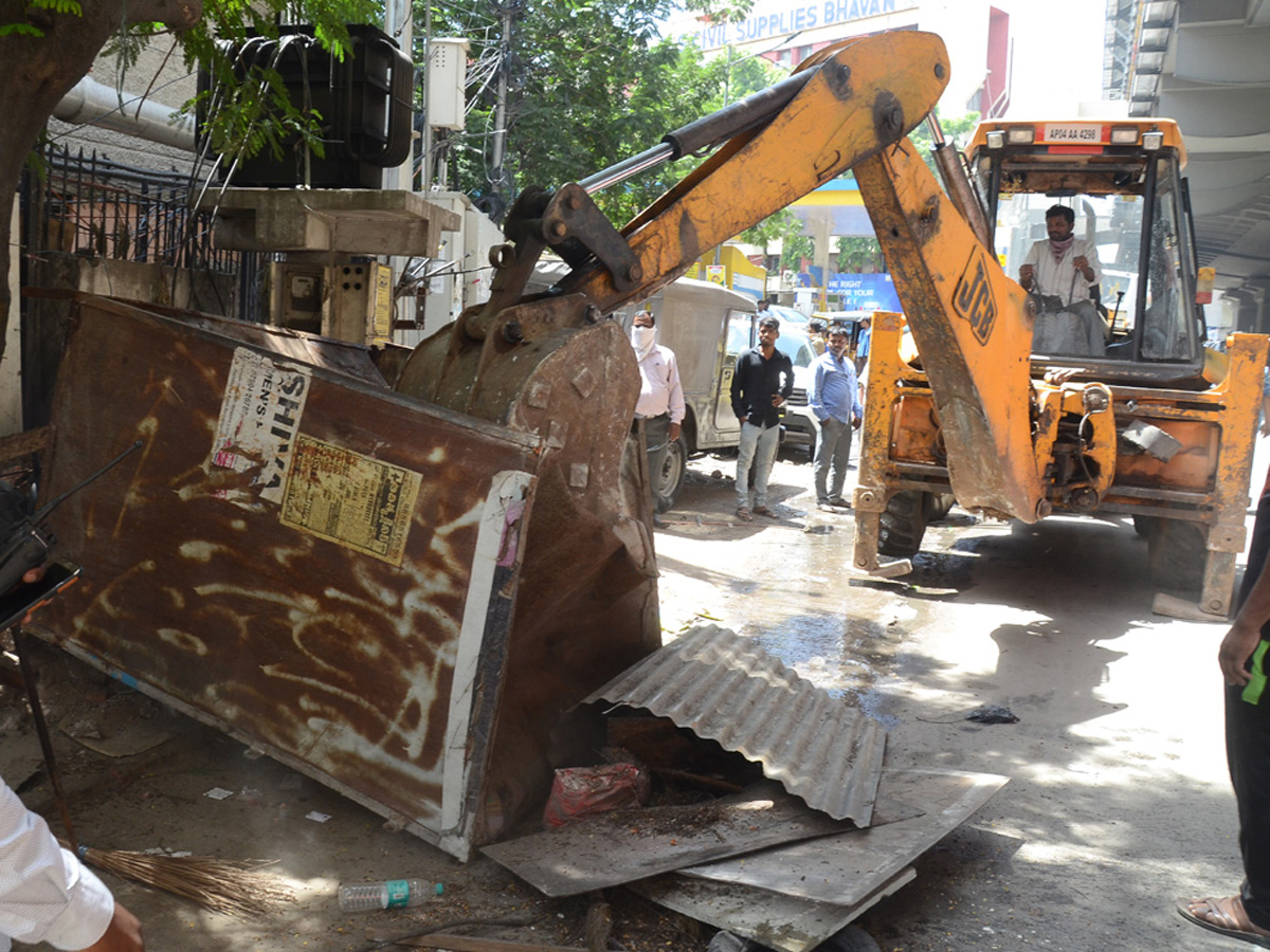 Demolition of Footpath Photo Gallery - Sakshi9