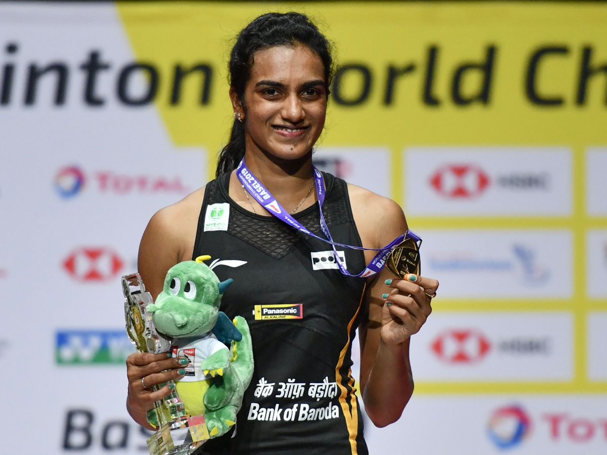 P V Sindhu Becomes First Indian To Clinch Badminton World Championships Gold - Sakshi6