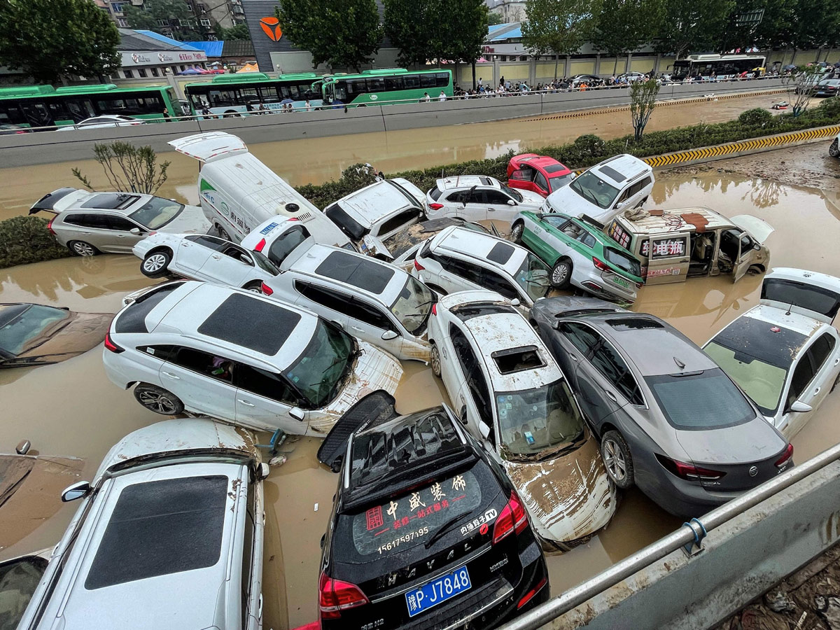 Heavy rainfall floods streets and subway stations in China Photo Gallery - Sakshi3