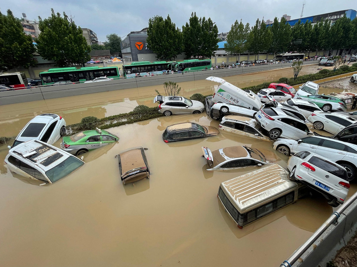 Heavy rainfall floods streets and subway stations in China Photo Gallery - Sakshi5