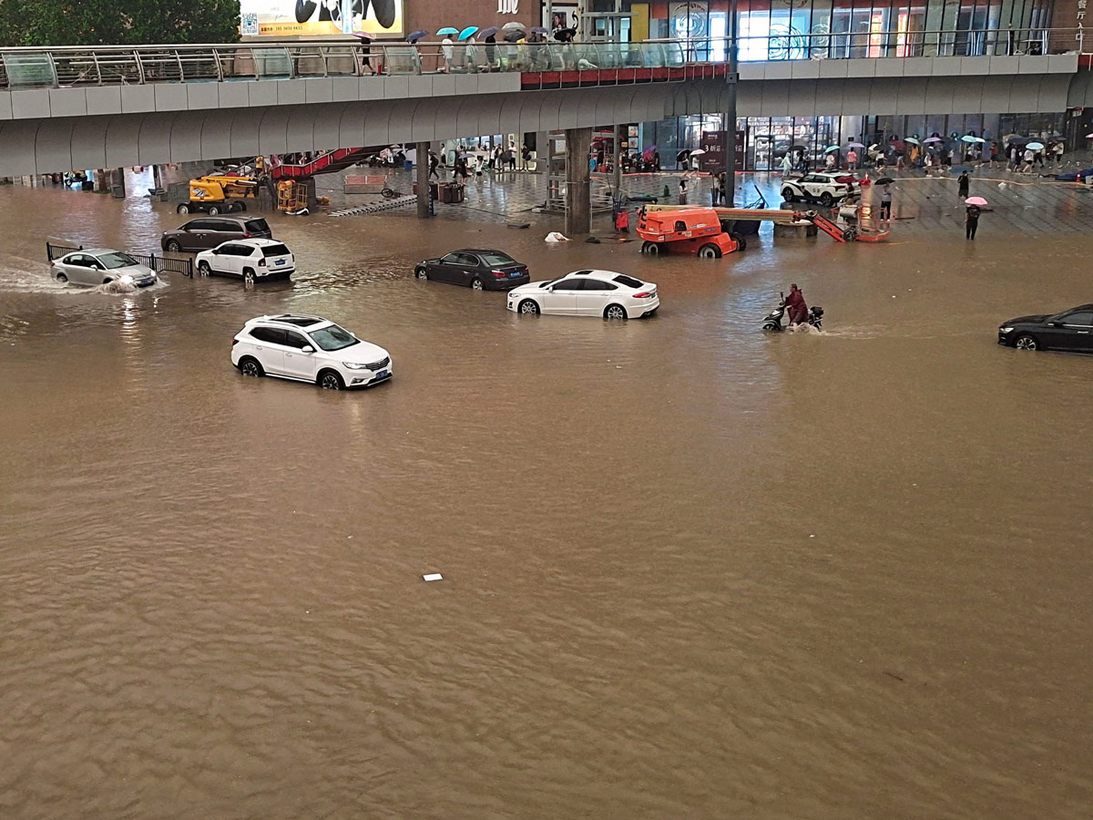 Heavy rainfall floods streets and subway stations in China Photo Gallery - Sakshi7