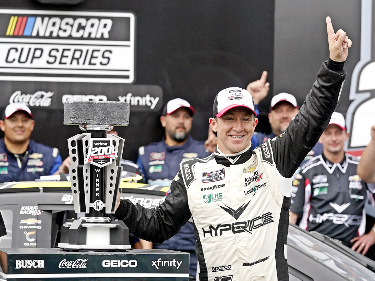 AJ Allmendinger celebrates after winning a NASCAR Series auto race Photo Gallery - Sakshi2