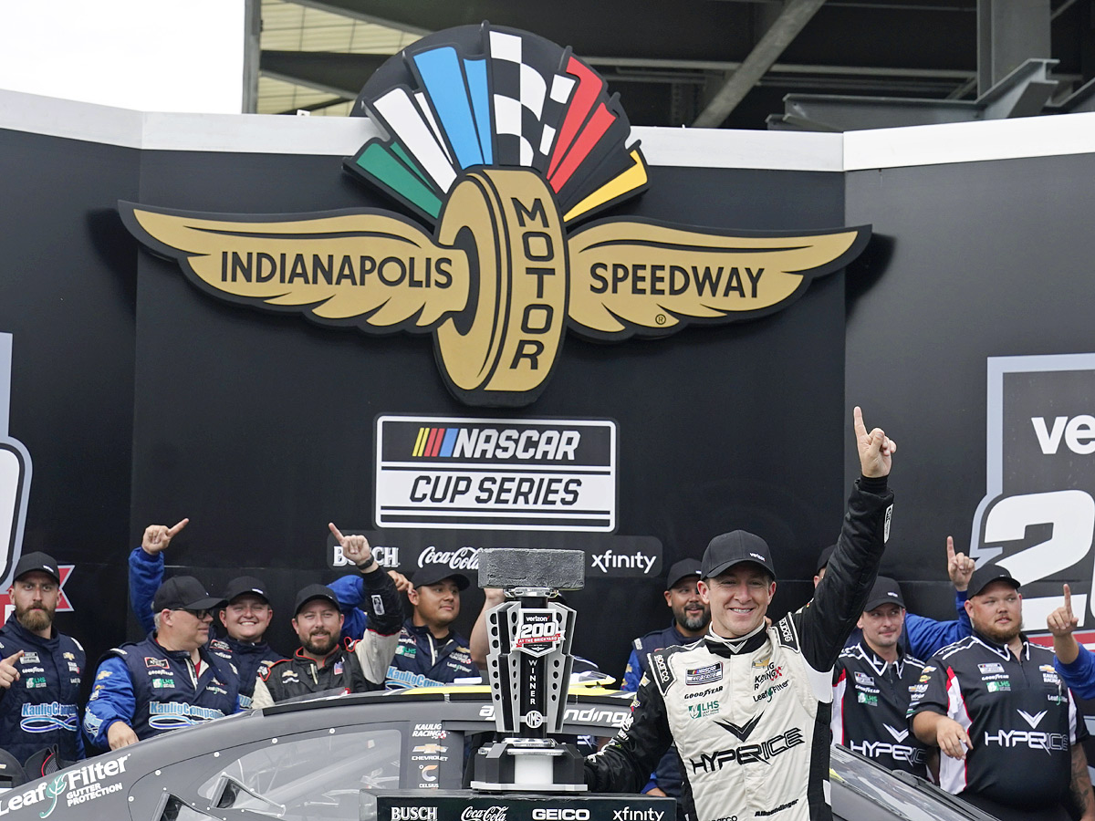 AJ Allmendinger celebrates after winning a NASCAR Series auto race Photo Gallery - Sakshi3