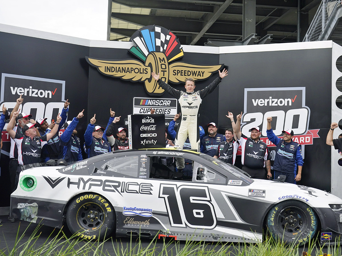 AJ Allmendinger celebrates after winning a NASCAR Series auto race Photo Gallery - Sakshi4
